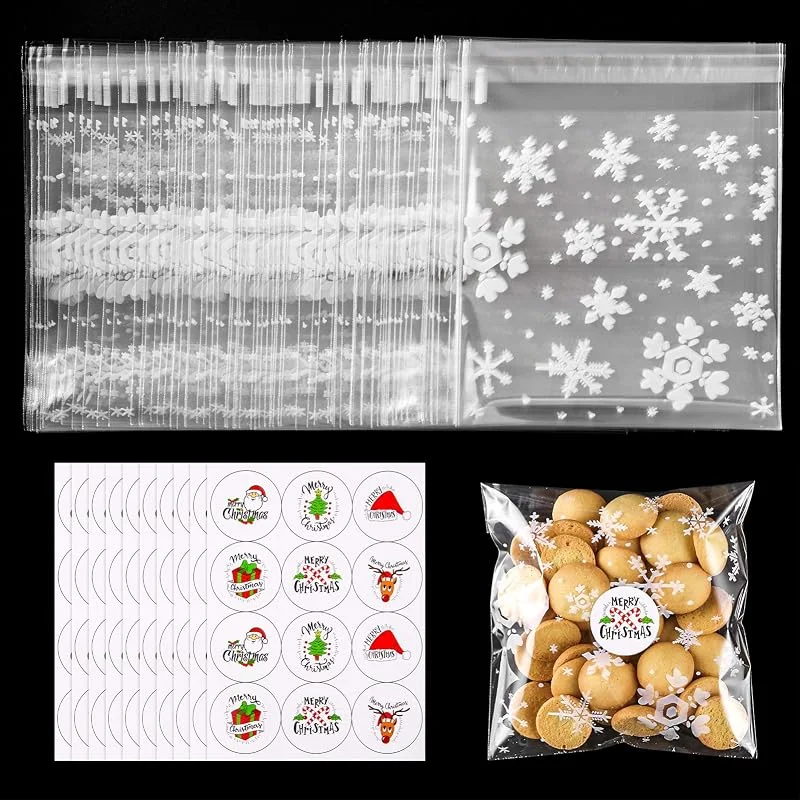 Visita la tienda de MELLIEX 100pcs Bolsas de Celofan Navidad Bolsas para Chuches Autoadhesivo Copo de Nieve Bolsitas de Regalos de Dulces Transparente con Pegatinas Navidad para Confeti de Aperitivos Dulces Galletas — Envoltorio regalo