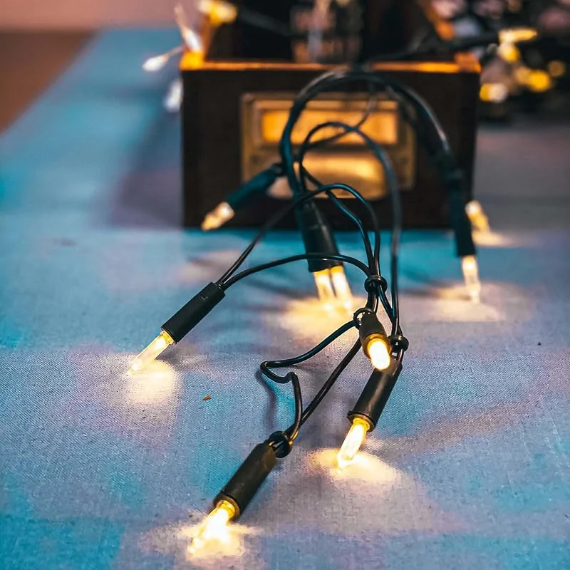 Visita la tienda de Hellum Hellum fairy luces de interior de energía operado, mini fairy luces 50 claras cálidas luz, iluminado 7, 35m, cable verde 50 luz <59 lumen 835014 — Luces Navidad
